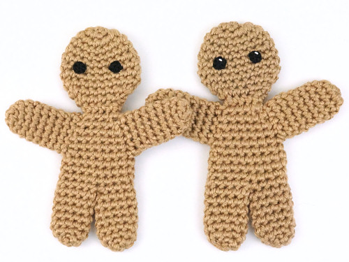 Gingerbread Man (crochet pattern by PlanetJune) with and without a glint in the eye