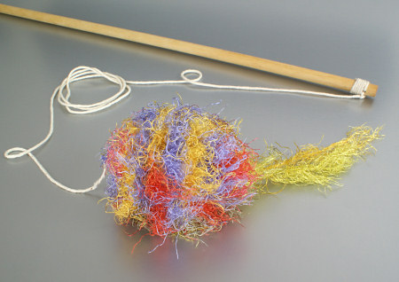 crocheted cat 'fishing' toy on a string by planetjune