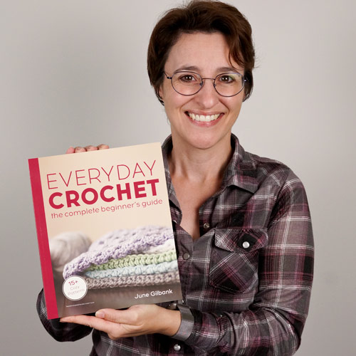 June Gilbank holding her new book, 'Everyday Crochet'