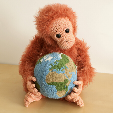 punchneedle globe (with crocheted orangutan) by planetjune