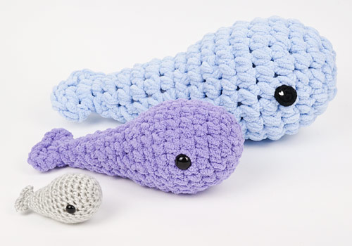 standard, mini giant and giant amigurumi whales, using the Tiny Whale crochet pattern by PlanetJune