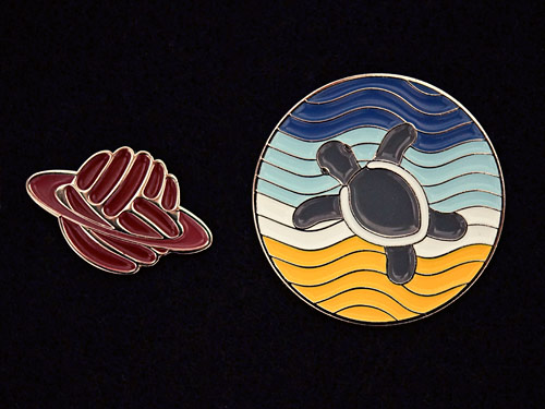 enamel pins: PlanetJune Logo and Turtle Beach designs