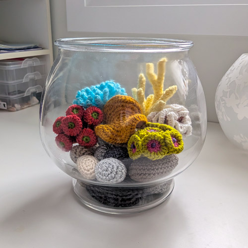 glass fishbowl with crocheted corals made from PlanetJune patterns