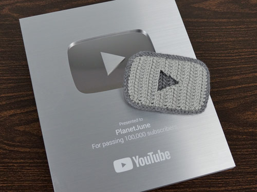 PlanetJune YouTube Silver Creator Award plus crocheted play button