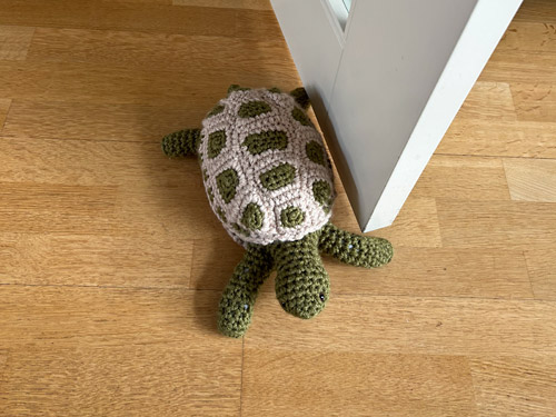 Anna's Tortoise Door Stopper, made from the PlanetJune Tortoise crochet pattern