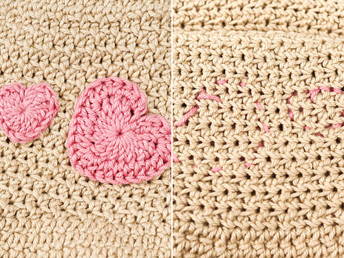 a crocheted applique stitched to a crocheted background